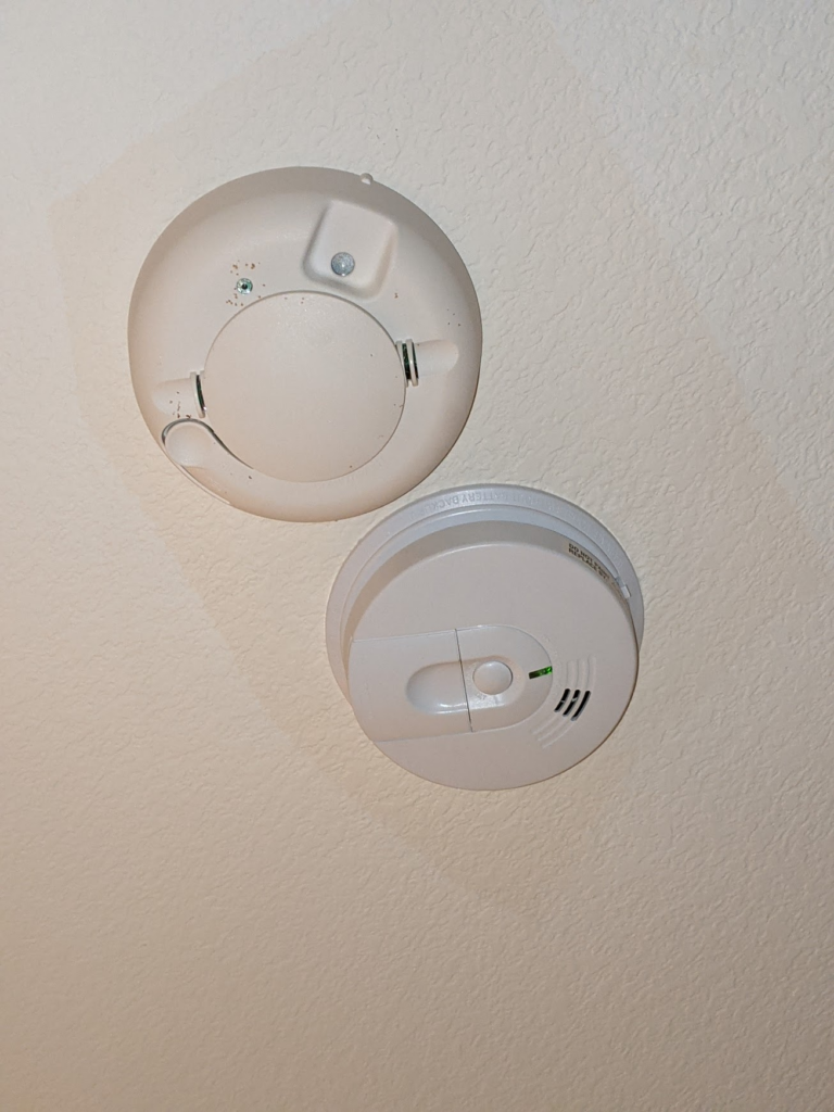 Photo of two smoke detectors next to each other