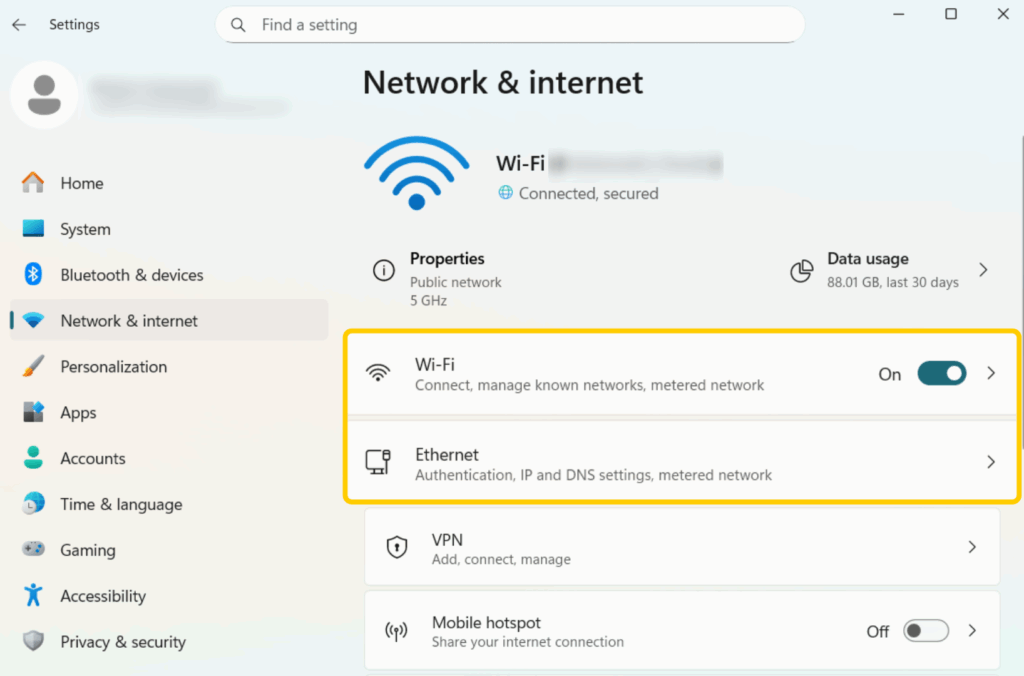Selecting the active Wi-Fi network in Windows 11 Network & Internet settings to share through Mobile Hotspot.