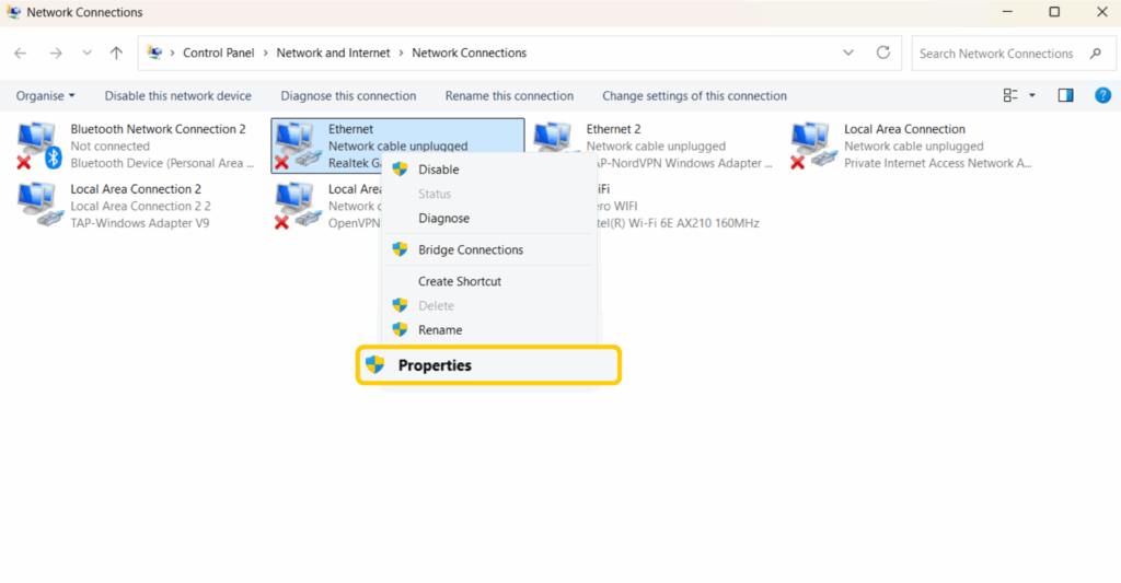 Windows Network Connections with the Ethernet adapter's Properties menu open.