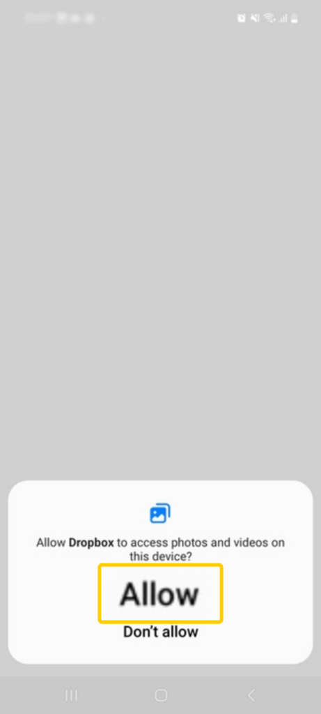 Screenshot of the Dropbox photos and videos permission window on Android.
