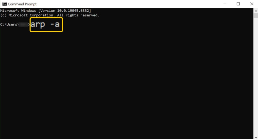 Screenshot showing the Command Prompt on Windows 10. The "arp -a" command is typed on the screen, and it's highlighted and enlarged.